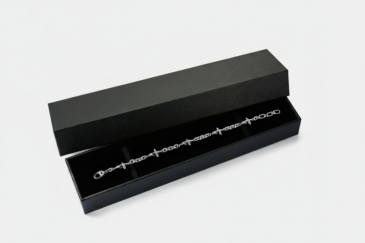 Silver bracelet in a black box on a white background